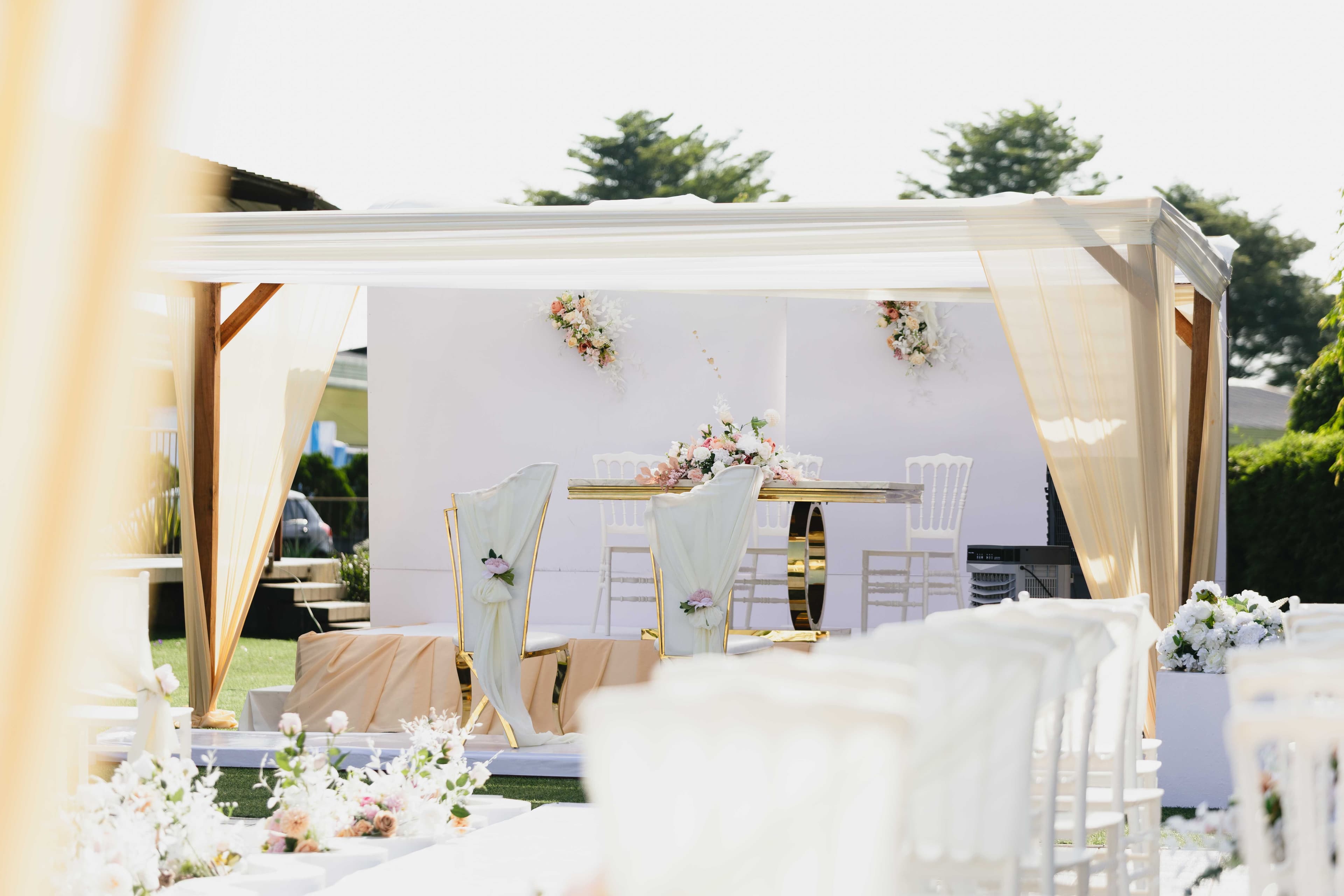 White marquee set up for an outdoor reception